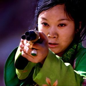 Foto Uma Mulher, uma Arma e uma Loja de Macarrão