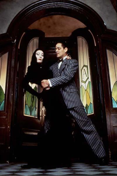A Família Addams : Fotos Raúl Julia, Anjelica Huston
