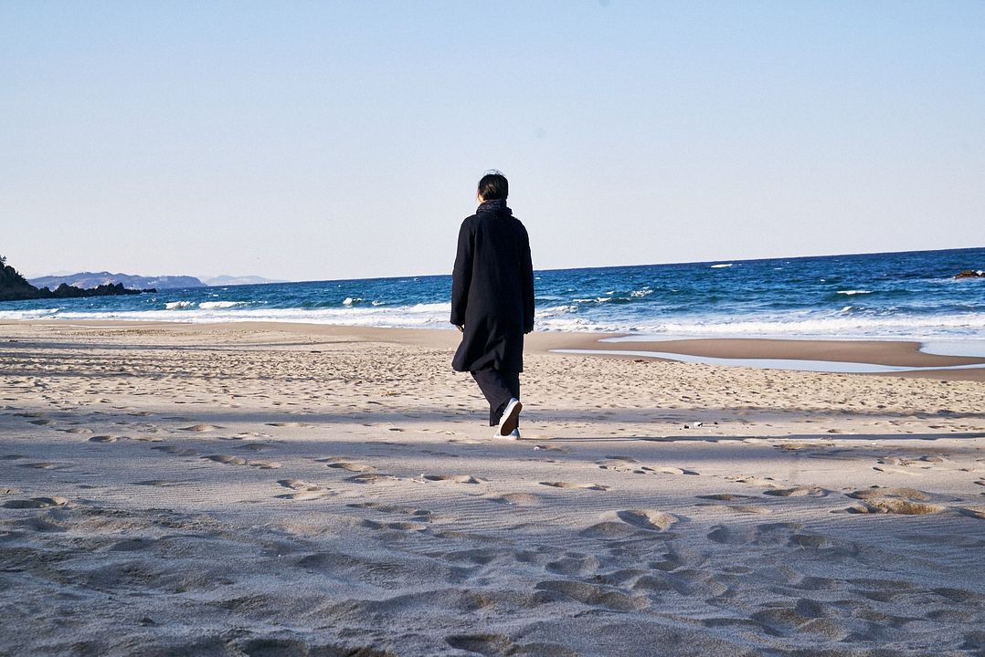 Na Praia à Noite Sozinha : Fotos